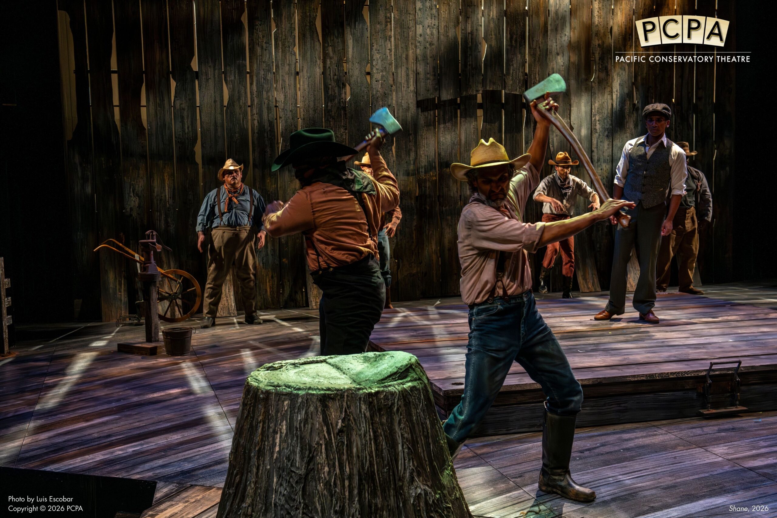 Actors cutting tree stump down