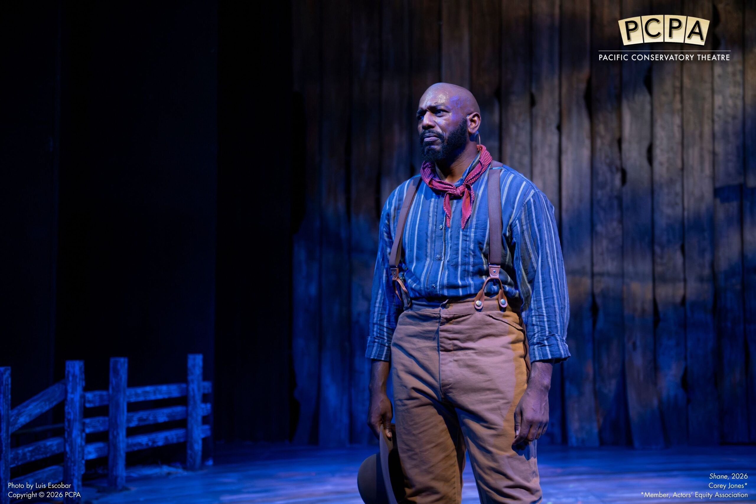 Actor standing looking off stage