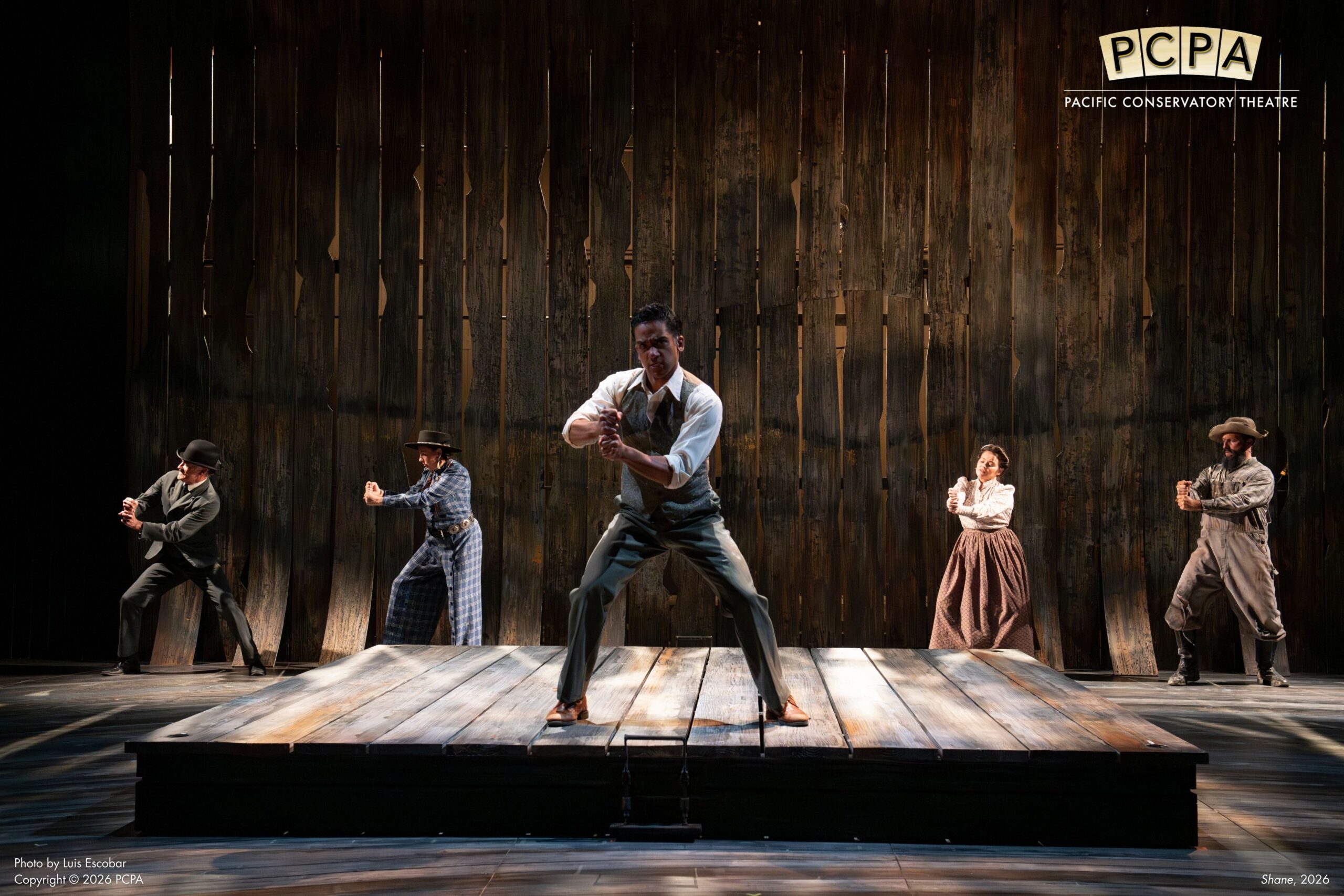 Actors dancing on stage