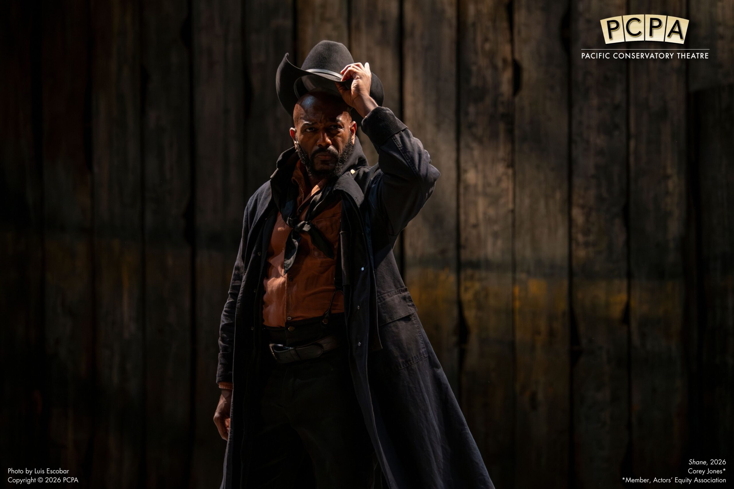 Shane lifting his has off his head