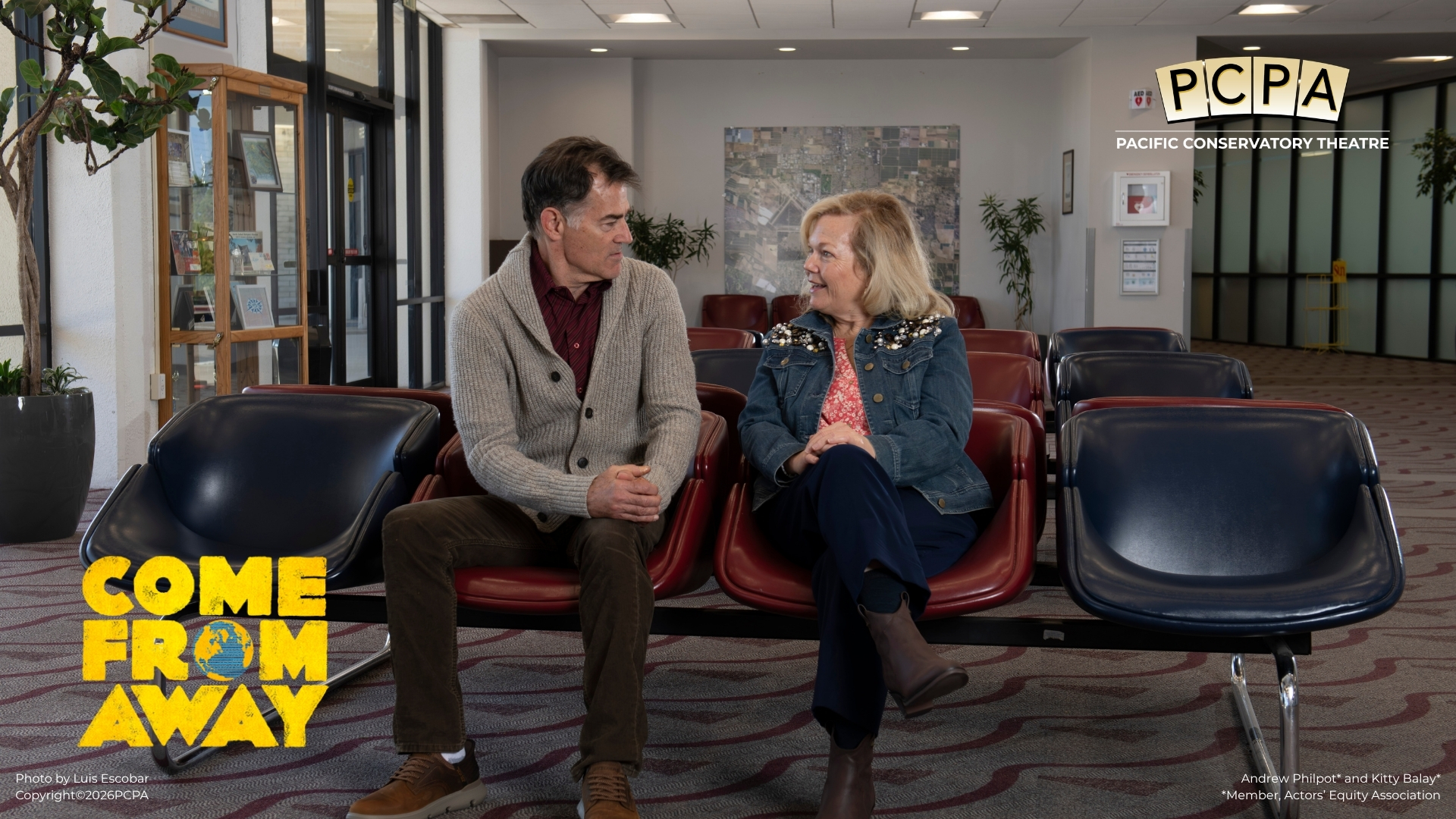 Two actors sitting on benches looking at each other