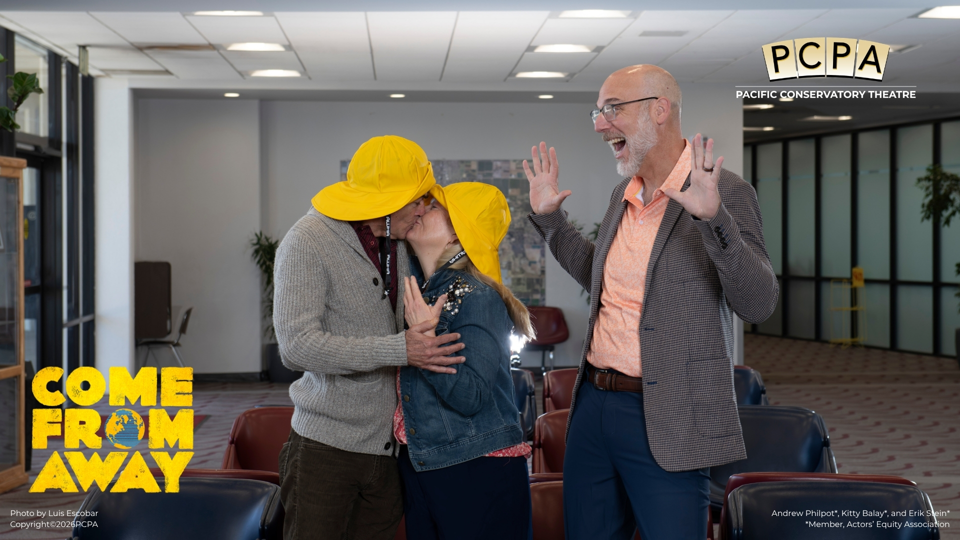 Two actors kissing and other actors looking at them happy
